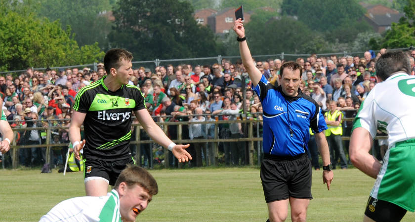Cillian O'Connor receives his black card after tripping Philip Butler [Picture: Malcolm McNally]